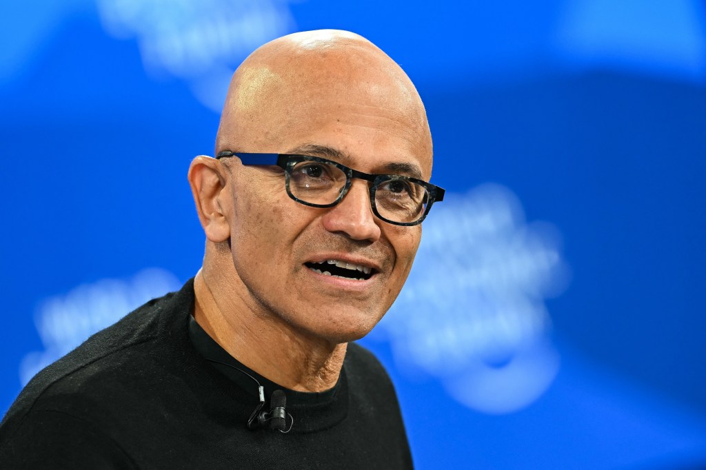 Microsoft CEO Satya Nadella reacts during the World Economic Forum (WEF) annual meeting in Davos on January 20, 2026. The World Economic Forum takes place in Davos from January 19 to January 23, 2026. (Photo by Fabrice COFFRINI / AFP)